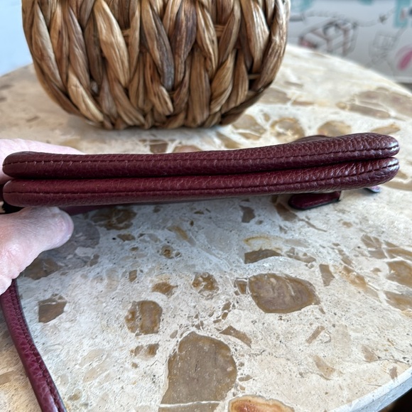 Coach double zipper wallet in burgundy pebbled leather. Measures 6 1/2” x 4”. - Picture 5 of 5